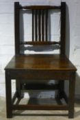 A 19th century Welsh oak dining chair and an oak stick back chair