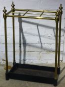 A brass umbrella stand