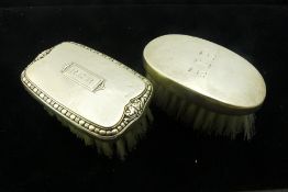 Two silver brushes