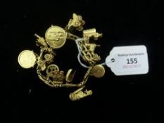 An 18 ct gold bracelet set with various gold charms