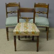 A pair of mahogany dining chairs and another