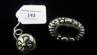 A boxed Georg Jensen silver brooch and a vintage sterling and onyx brooch