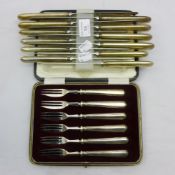 A set of twelve silver handled knives together with a cased set of silver handled forks