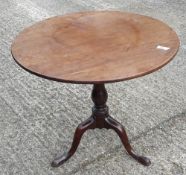 A George III mahogany tilt top tripod table with birdcage movement