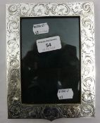 An engraved antique sterling silver photo frame