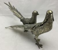 A pair of metal pheasants