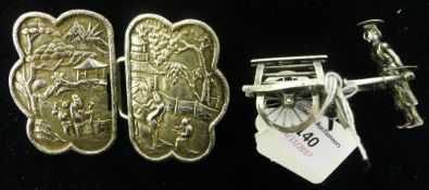 A 19th century Chinese Canton silver buckle and a small Chinese silver figure of a street trader