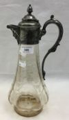 A silver plated decanter