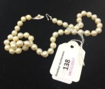 A pearl necklace with silver clasp