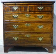 A small mahogany chest of drawers with a brushing slide CONDITION REPORTS: Generally