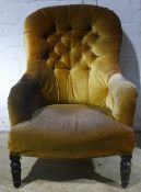 A Victorian button-back armchair