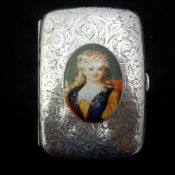 A silver cigarette case depicting a girl