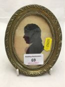 A Victorian silhouette in a brass frame