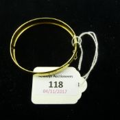 A 9 ct gold bangle (8 grammes all in)