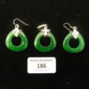 A pair of silver and jade earrings and pendant en-suite