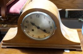 An early 20th century oak mantle clock