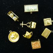 A quantity of 9 ct gold charms (17 grammes all in)