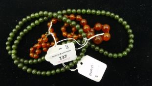 A spinach green jade necklace,