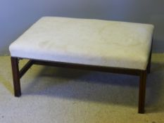 A large modern foot stool