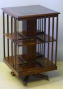 A modern mahogany revolving bookcase