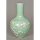 A Chinese celadon vase Of bulbous form with elongated neck,