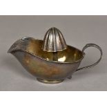 An Italian Sterling silver lemon squeezer Of sauce boat form. 15.5 cm long.