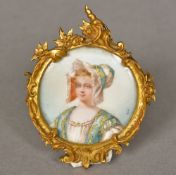 A 19th century miniature on ivory Depicting a young girl wearing a bonnet with gilt heightening,