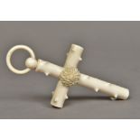 A Victorian carved ivory crucifix Faux bois centred with a rosette, with suspension ring.