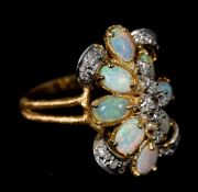 A 14 K gold, opal and diamond cluster ring 2.5 cm high.
