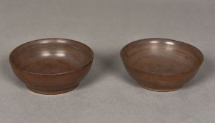 A pair of Chinese carved hardstone bowls Each with inscribed four character archaistic seal mark to