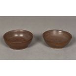 A pair of Chinese carved hardstone bowls Each with inscribed four character archaistic seal mark to