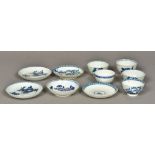 Four 18th century English blue and white porcelain tea bowls and saucers,