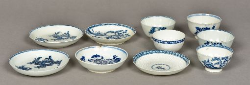 Four 18th century English blue and white porcelain tea bowls and saucers,