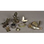 A small collection of various Oriental and Eastern items Including: two white metal models of junks,