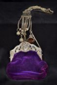 A late 19th/early 20th century Continental silver mounted purse The pierced clasp with figural and