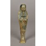 An Egyptian Ushabti Of typical form. 14.5 cm high.
