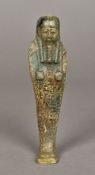 An Egyptian Ushabti Of typical form. 14.5 cm high.