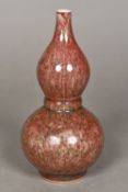 A Chinese porcelain double gourd vase With allover souffle glaze. 21 cm high.