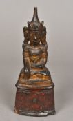 An antique, possibly 18th century, Thai gilt painted model of Buddha Typically modelled,