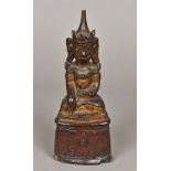 An antique, possibly 18th century, Thai gilt painted model of Buddha Typically modelled,