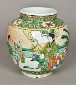 A Chinese famille verte porcelain vase Decorated in the round with children and female figures in a
