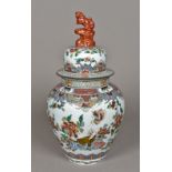 A Chinese porcelain vase and cover Decorated with precious objects amongst floral sprays,