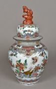 A Chinese porcelain vase and cover Decorated with precious objects amongst floral sprays,