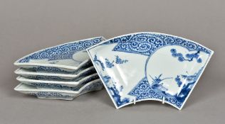 A set of five 18th century Japanese blue and white Arita porcelain fan shaped dishes Each decorated