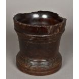 A large English lignum vitae mortar, possibly 17th century Of typical turned form. 19.5 cm high.