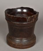 A large English lignum vitae mortar, possibly 17th century Of typical turned form. 19.5 cm high.