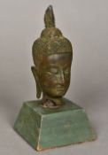 A 17th century or early Siamese bronze head of Buddha Well patinated with mother-of-pearl inlaid