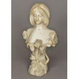 An Art Nouveau marble bust Carved as a young lady amongst floral sprays. 55 cm high.