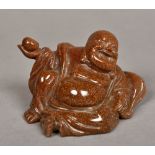 A Chinese carved gold stone Buddha Modelled recumbent. 6 cm high.