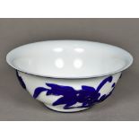 A Chinese Peking glass bowl Blue flashed on a white ground and decorated with an aquatic scene.